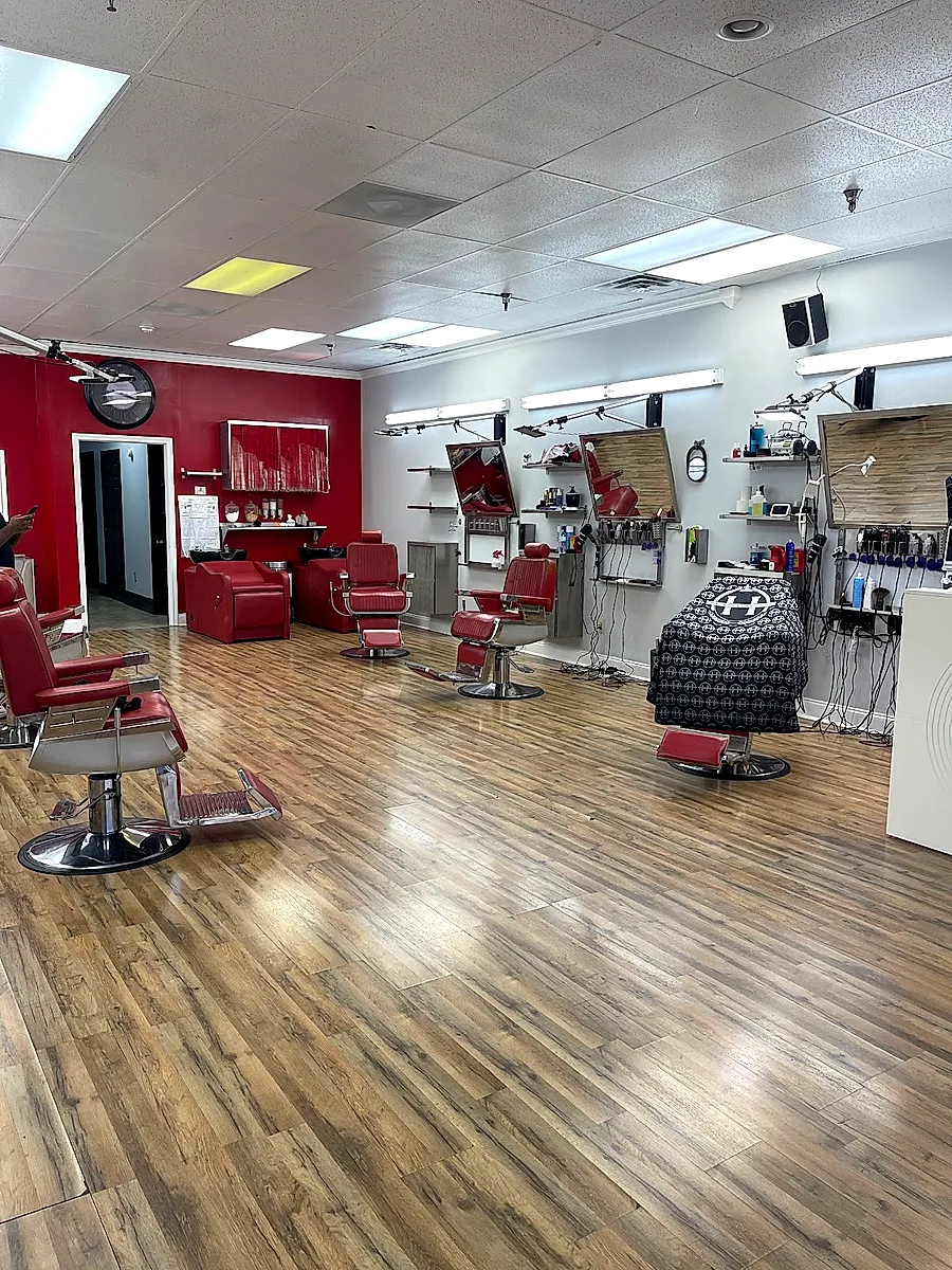 Red barber chairs and mirrors at Hairtrapreneur